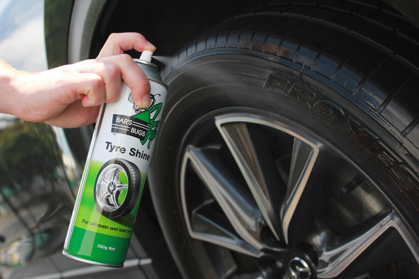 Bar's Bugs Tyre Shine spraying on Mazda 