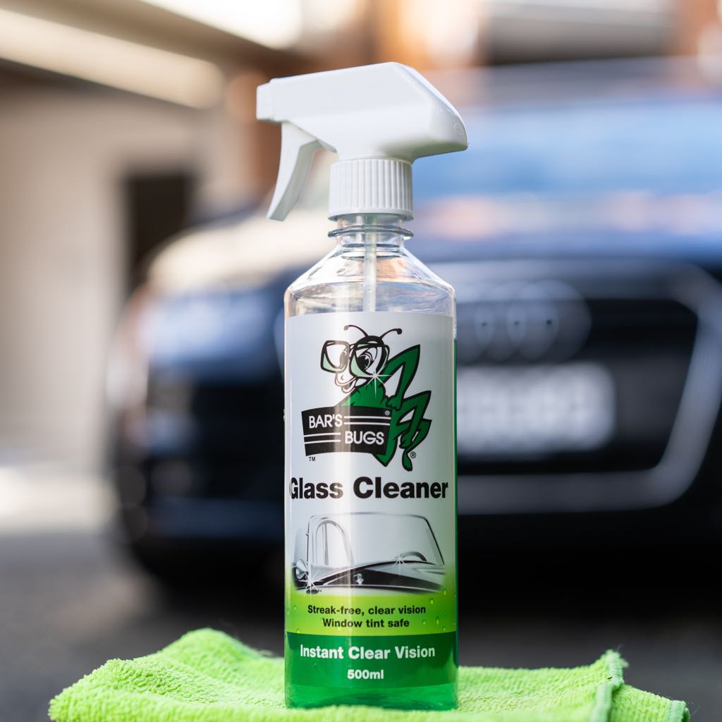 Bar's Bugs Glass Cleaner on Microfibre Cloth in front of Audi
